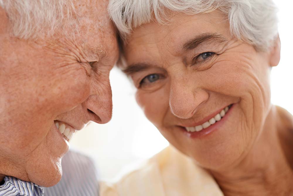 Close up of senior couple touching foreheads